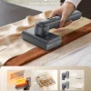 fast-dual-voltage-global-travel-garment-steamer Epicka handheld garment steamer smoothing wrinkles on fabric, featuring 15s fast heating and two steam levels.